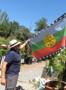 David shows the flag of his Mapuche people