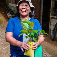 Participant of a Rainforestation training with her recently collected wildings, Philippines